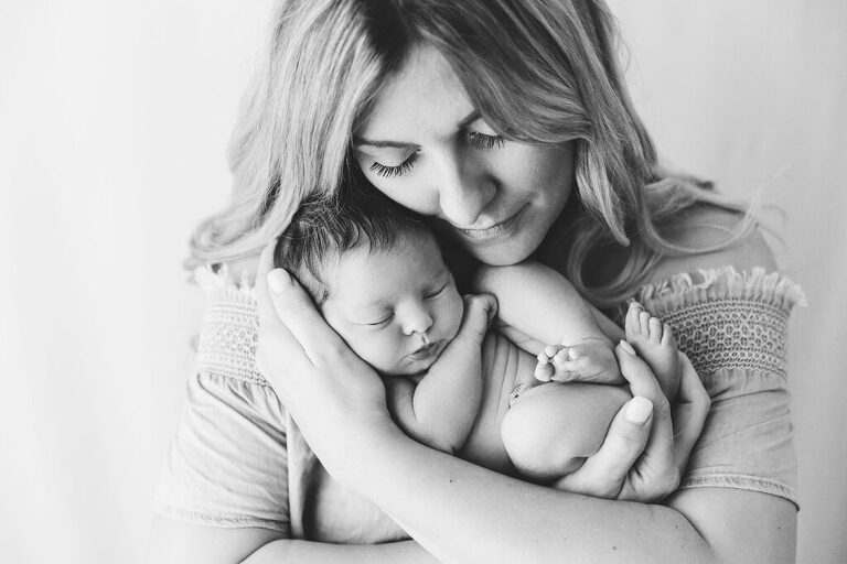 mom with newborn baby - trinity newborn photographer