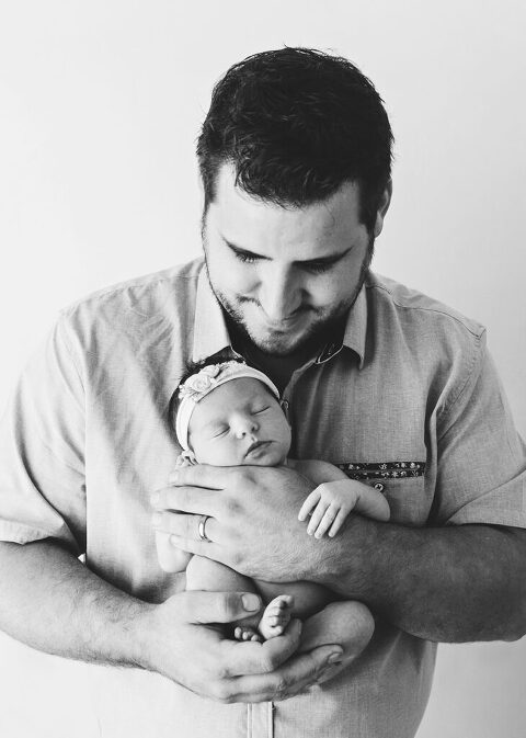 dad with newborn baby - trinity newborn photographer