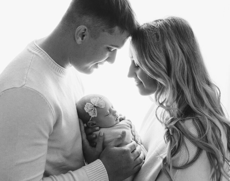 parents with newborn baby - black and white newborn photo with parents