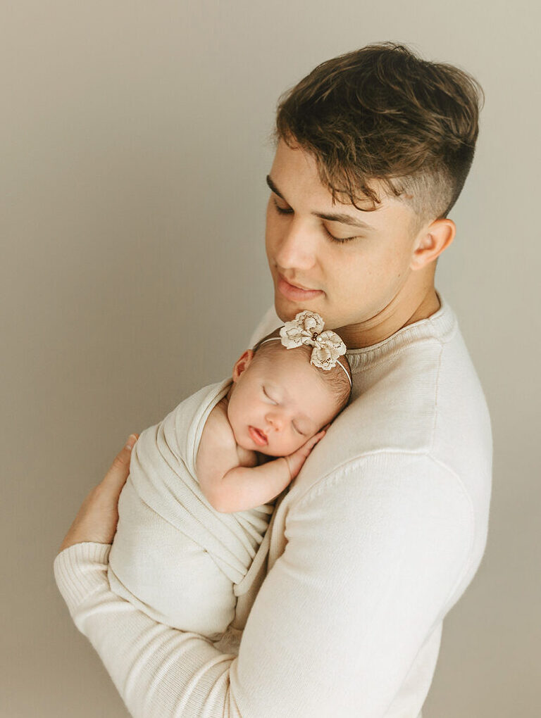 dad with newborn baby