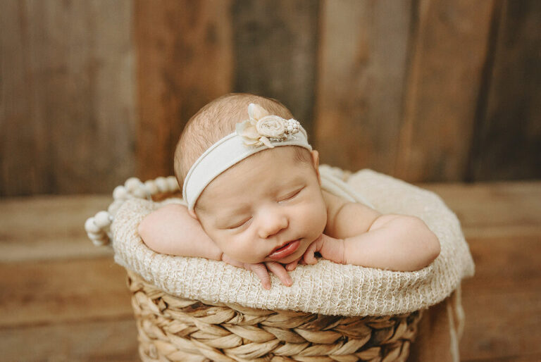 newborn baby in a bucket