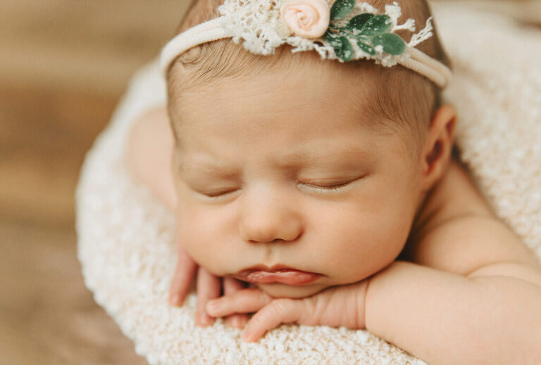 newborn baby in a bucket
