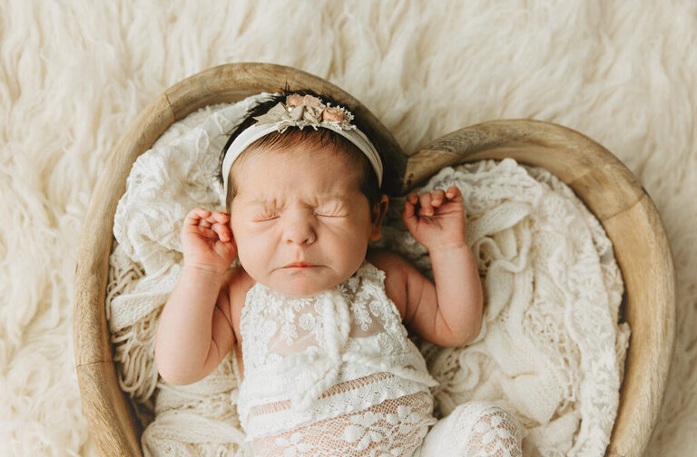 baby in a heart basket - trinity FL newborn photographer